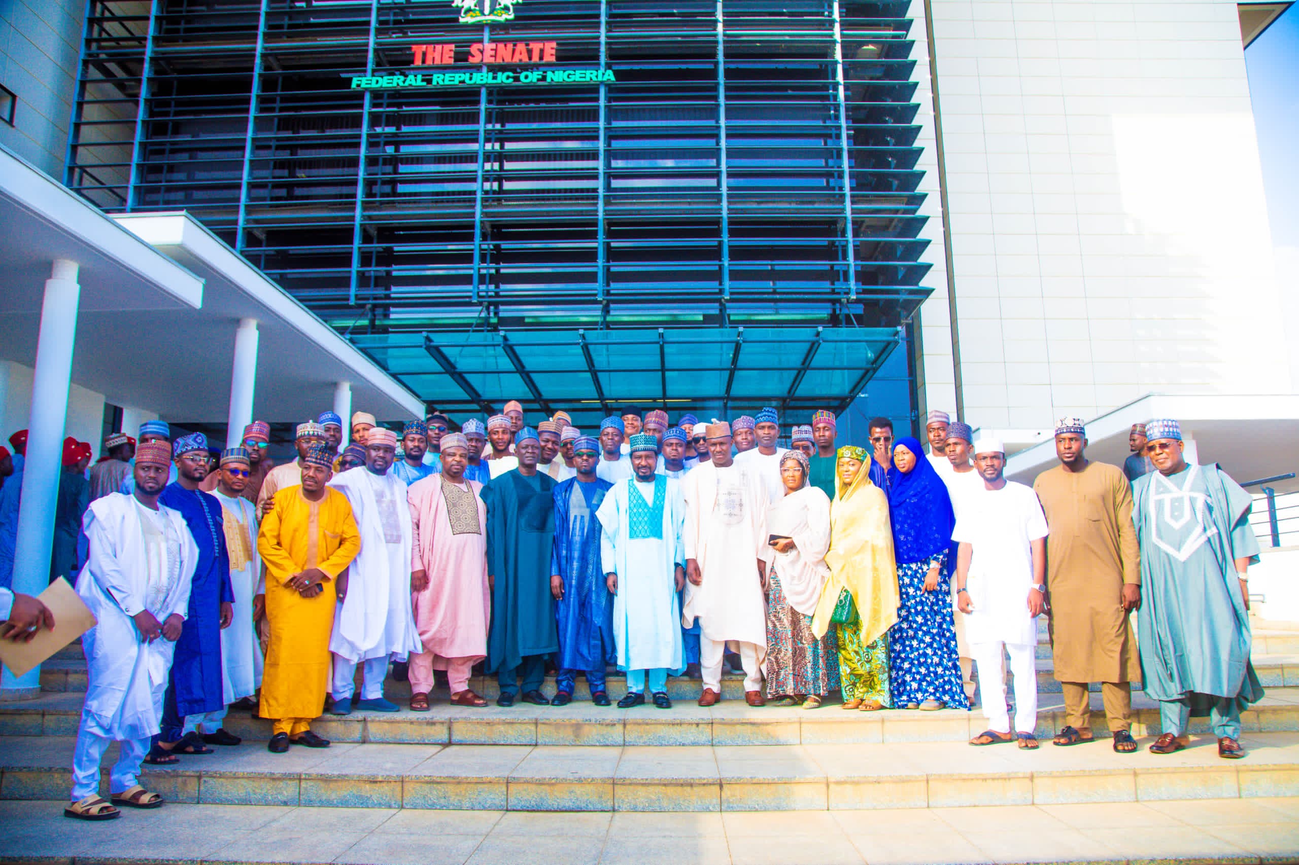 APC youths describe Barau as catalyst for Kano development,   A group of youths under the coalition of All Progressives Congress (APC) Forum, Kano State, on Monday, discribed the Deputy President of the Senate, Senator Barau I Jibrin, as a bulldozer of the development of the state  Hundred of Members of the forum from across the 44 Local Government Areas of Kano State paid a courtesy call to the Deputy President of the Senate at the National Assembly on Monday. The event was attended by Senator Babangida Hussaini (APC, Jigawa), Senator Muntari Dandutse (APC, Katsina), Senator Ibrahim Lamido (APC,Sokoto) and a member of the House of Representatives, Dambatta/Makoda Federal Constituency of Kano State, Rep Hamisu Ibrahim Chidari. Chairman of the forum, Hon Adamu Mukhtar, said the Deputy President of the Senate has always been at the forefront of the development of Kano State and the APC. Urging him to sustain the tempo, he said they are working hard to unite the party in all the nooks and crannies of Kano State. ” You are the bulldozer of the development of Kano State. Please continue with the good work you are doing. Don’t relent. We are solidly behind you,” he said. Stressing the importance of unity in the party, he said, “We will embark on a massive campaign across the 44 local government areas. Many youth who are members of the opposition  parties have indicated interest in joining us in the APC.”  Responding, the Deputy President of the Senate, Senator Barau I Jibrin, commended the youth for mobilising for the party.  ” This is a good initiative. This was what we did in the Second Republic. We mobilised for our party without having any intention to contest for elections. We were only after the success of our party. I’m happy you have embarked on the same journey,” he said. He reminded the youth that the future of Kano and, indeed, the country is in their hands. ” The future of Kano and Nigeria politics is in your hands. The future is yours. Take this seriously. You will go places. We are with you 100 per cent. ” I also urge you always to ensure that the right people are given the mantle of leadership, from ward to all levels. This is the way to go. If the right persons are given, victory, Insha Allah, will be ours. If we form government in Kano State, youth will be the greatest beneficiaries.  In their speeches, Senator Babangida Hussaini (APC, Jigawa), Senator Muntari Dandutse (APC, Katsina), Senator Ibrahim Lamido (APC, Sokoto) and a member of the House of Representatives, Dambatta/Makoda Federal Constituency of Kano State, Rep Hamisu Ibrahim Chidari, extolled the virtues of Senator Barau, describing him as a senator for all, committed to the development of the country.